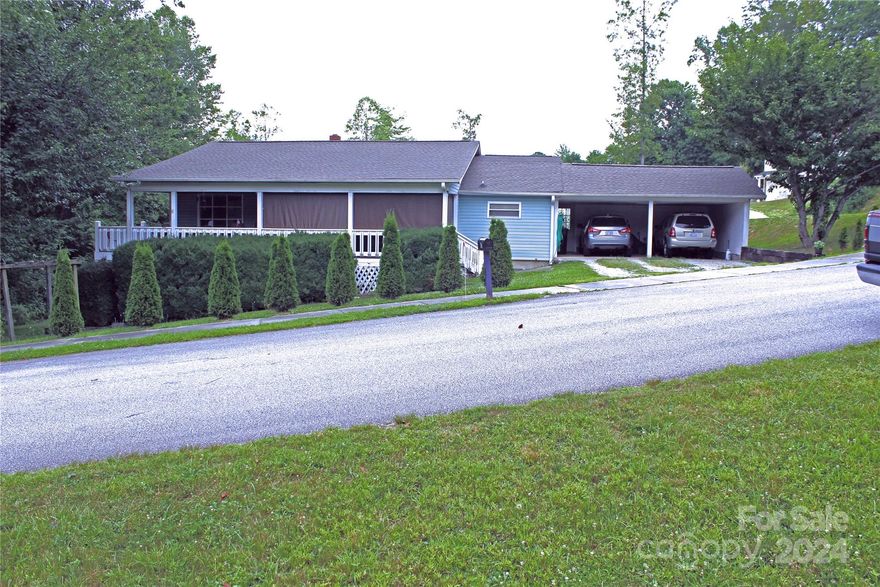 Value exists here in this 2 BR/2 BA rancher home convenient to many areas of Hendersonville.  Call today to preview this wonderful home complete with a large, rocking chair front porch, two car carport and get excited that it does not have city taxes.  Enjoy one level living with a thoughtful design and in updates in 2019 including heat pump and roof.  Minutes from Blue Ridge Mall, I-26 and downtown Hendersonville.  Interior photos coming soon.