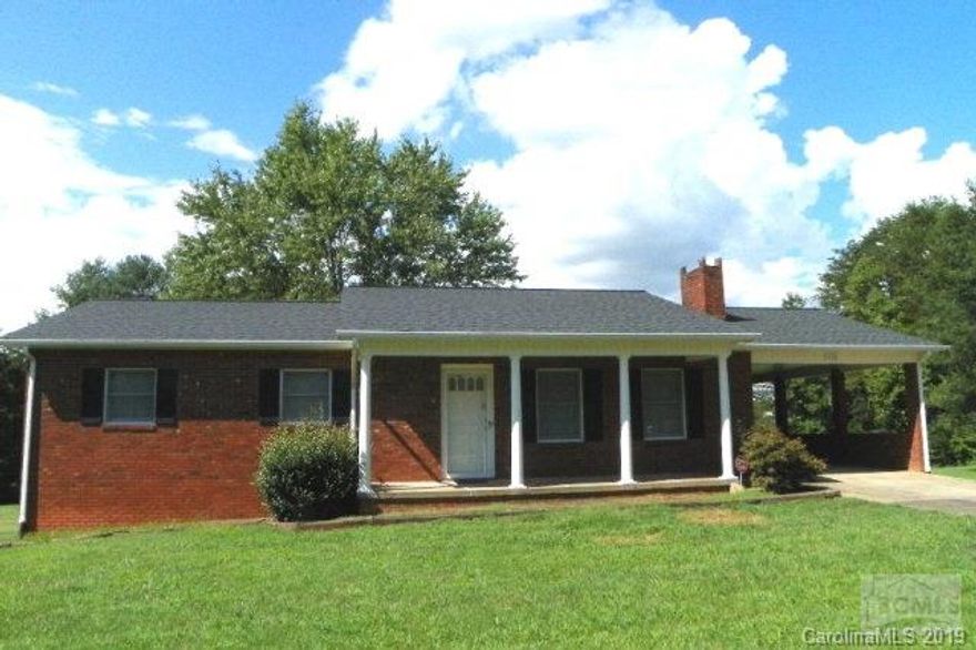 What a gem!  Well maintained 3BR/1.5Ba on main level features living room with brick fireplace, open kitchen/dining, master bathroom with half-bath, and two additional bedrooms. On lower level is an apartment with private entrance ideal for teenager or in-law suite with open living/dining/kitchen, bedroom, and full bath. Ceiling height in apartment is 6'10&1/2. total square footage includes apartment. Single attached carport and BI garage. Security system. Also includes record #31542. Seller providing one-year home warranty. Home convenient to several State-owned facilities as well as short distance to I-40 Exit 104.  New roof installed August 2016.