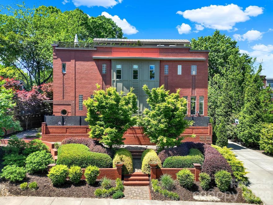 Live in luxury in the heart of historic Dilworth. Perfectly perched in Charlotte’s most desirable neighborhood, this striking all-brick end-unit townhome is a rare find with no HOA. It truly stands in a class of its own.

Spanning 2,800+ square feet across four levels, the airy residence is defined by elegant white oak hardwoods, 10-ft ceilings, and a chef’s kitchen featuring a premier Italian range and a whole-house water filtration system. The sun-drenched great room offers a warm welcome, while a soaring 19-ft barrel-vaulted ceiling crowns the primary suite. This retreat includes ample custom closets and specialized storage space.

For the ultimate urban escape, a private loft leads to a 400 sq ft rooftop terrace with sweeping canopy and city views. This immaculate home features three outdoor living areas, a private courtyard, plus a two-car garage with premium poly-coat floors. Premier dining, boutique shopping, and the Light Rail are all within walking distance, keeping every essential convenience close at hand. This is not just a home; this is a statement.
