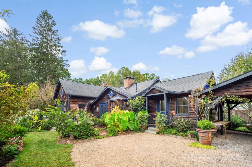 Over 2.5 Acres. Orchard. Adorable Home. Buildable Land. One Mile to Town. A rare private sanctuary and homestead—flexible, peaceful, and increasingly hard to find. Properties offering this unusual combination of usable land, privacy, and proximity to town rarely come to market. Set just one mile from Black Mountain, this just-over-2.5-acre R-8 property provides both what’s already established and room to grow. Approximately one acre is planted with orchards, gardens, tea plants, and lovely community gathering spaces. The remaining acreage is open, usable, and buildable, offering exceptional flexibility for expansion, additional structures, or future vision—while still preserving privacy. The character-rich 1930 home is light-filled and welcoming, with refinished hardwood floors, custom solid-wood doors, beamed ceilings, multiple fireplaces, and seamless indoor-outdoor flow to wraparound decks and gardens. The kitchen is designed for true farm-to-table living and everyday gathering. Recent improvements include a brand-new dual-fuel heat pump and furnace, bringing modern efficiency and year-round comfort to this timeless setting. Additional structures—including a charming cabin, greenhouse, and a classic two-story red barn with workshop and finished spaces—create rare versatility for guests, creative pursuits, or home-based work. The land itself feels special—quiet, grounded, and restorative. Many who visit remark about the sense of calm, presence and beauty that’s immediately felt here. Replicating this combination of location, usable land, zoning, and established infrastructure this close to town would be exceptionally difficult today. This is not a mass-market property. It’s for the buyer who recognizes rarity, values land and flexibility, and understands that places like this are disappearing.