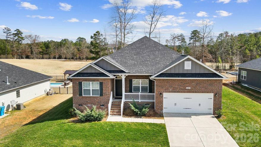 Welcome home to this lovely ranch with open concept living and an in-ground pool located on the Redbridge Golf Course! This home is move-in ready and features 4 bedrooms, 2 baths, and an incredible outdoor entertaining area! Step inside to find a formal dining room, spacious great room with fireplace, a well appointed kitchen featuring stainless appliances, center island with barstool seating and subway tile backsplash, a spacious owner's suite with private bath and walk-in closet, three generous size secondary bedrooms, a second full bath and a conveniently located laundry room. Enjoying the outdoors is easy from the covered deck that overlooks the in-ground pool with tanning ledge and beautiful golf course views.  This conveniently located home is minutes away from Rocky River Vineyards and great shopping and dining. Red Bridge Golf Club is a semi-private, championship golf course situated on 500 acres in the foothills of the Uwharrie Mountains. There is no HOA in the community, golf course requires separate membership or fees to play.