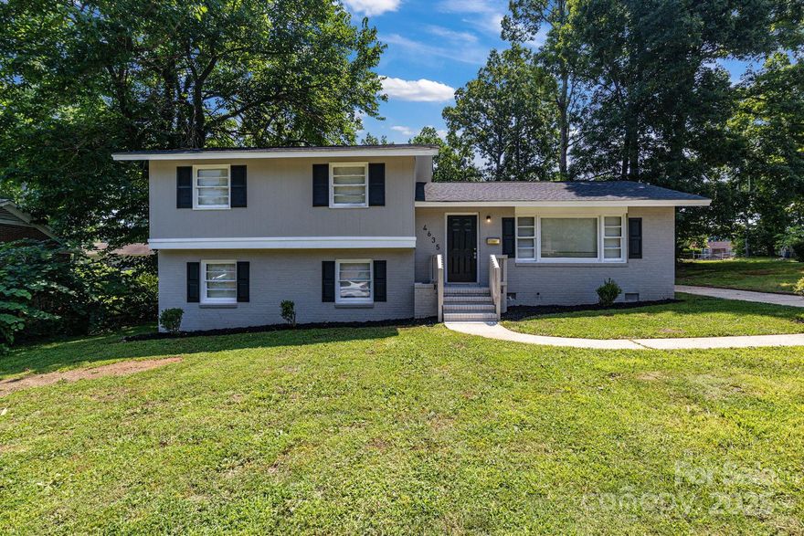 *THIS HOME QUALIFIES FOR 100% FINANCING, $15,000 RATE BUY DOWN, UP TO $5,000 IN CLOSING COSTS & NO PMI!!* Unforgettable 4 bed 2.5 bath 1936 sq. ft. (!!) split-level in Charlotte!! ALL the space you've been desperately searching for in a home at an UNBEATABLE price. Split-level design offers a functional layout that is both highly convenient & comfortable. Walking in, the expansive living room meets a modernly updated kitchen. Kitchen improvements incl. abundance of NEW shaker-style cabinets, SS appliances, granite counters & subway tile backsplash. Finished basement is the grand boon of the home, as one bonus room is perfect for an office, home gym, or media room (w/ convenient half-bath en-suite) while 2nd bonus room can function as an add'l bedroom if desired. Three oversized bedrooms w/ two updated full baths are privately tucked away upstairs. Primary bedroom includes en-suite full bath & walk-in closet for the utmost convenience. Home features refinished hardwoods, new LVP throughout, interior & exterior paint overhaul, new six panel doors & much more. At this price, you can't lose!!