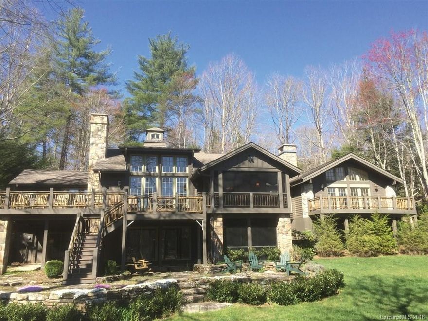 One of Lake Toxaway's most cherished lakefront homes situated on one of Lake Toxaway's most gentle sites.  This 4BR, 4.5 BA well appointed home features two bedroom suites on the main floor, heart pine floors, stone wood burning fireplace, vaulted ceilings, wood paneled walls, fabulous screened porch and extensive open deck with fantastic view of Lake Toxaway.  A gracious open boathouse with large sun deck above for dining and recreation make this one of the most desirable lakefront homes.