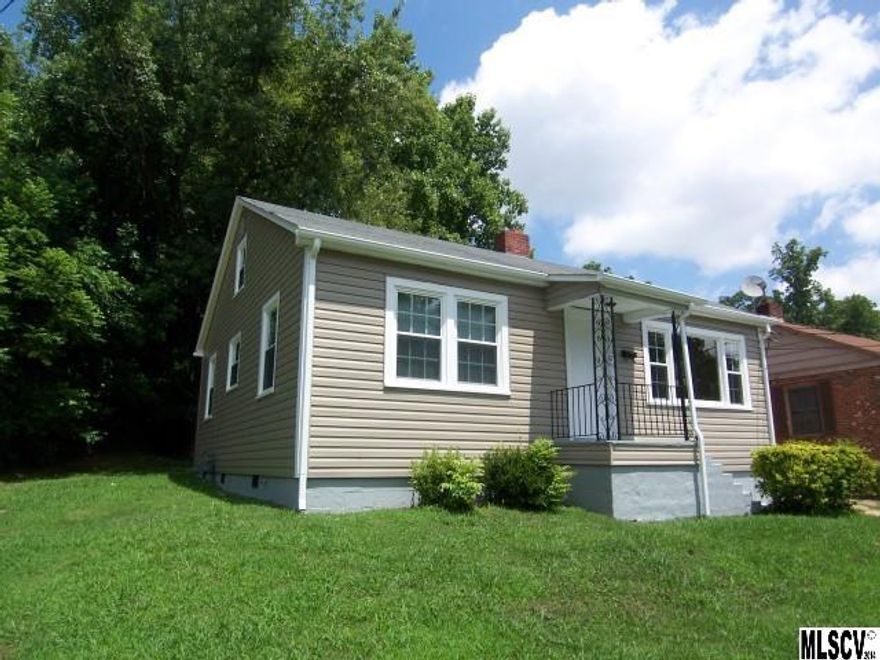 THIS REALLY CUTE, RENOVATED BUNGALOW IS READY FOR YOU...WHY PAY RENT WHEN YOU CAN BUY & PAY LESS!! This 2BR home has a 2008 HEAT PUMP that becomes even more efficient with your 2014 WINDOWS & 2014 VINYL SIDING; along with 2014 GUTTERS!! Talk about low maintenance & move-in ready ... the floors in the LR & BRs have been refinished displaying the pretty pine beneath. Some laminate is in the hall & Kit/DR area, as well. The new electric range and existing fridge remain in a nice sized kitchen! A large pull down attic will store anything you need it to! AND, THIS HOME IS ON ONLY 1 OF 3 LOTS THAT ARE BEING SOLD TOGETHER! You have plenty of room to build a big garage &/or workshop! Conveniently located near the elementary school & close to work, you WON'T FIND A BETTER DEAL! Don't let it get away, be sure to CALL TODAY!