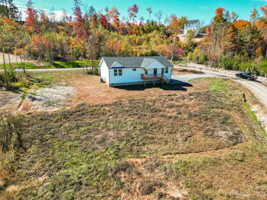 Builder now offering $8,000 rate buy down credit to alleviate pressure from interest rates! Welcome to the Brand New Old Vineyard Village Subdivision with High Speed Charter Internet and low HOA fees. Only 3 miles from DT Old Fort and I-40. Huge Yard! Open floor plan bathed with warm natural light is perfect for entertaining. Roomy primary bedroom boasts an extra large walk-in closet and elegant primary bath with dual vanity and custom tile shower. Luxury vinyl plank flooring, fabulous kitchen with stainless steel appliances, granite counters, spacious all-plywood soft close cabinets, under cabinet lighting, and the perfect kitchen island. Neutral colors make decorating a breeze. Large decks are a spectacular place to enjoy that clean mountain air. Well-priced, move-in ready and waiting hold all of your fond memories or become your next retreat. Finished interior pictures are shown as an example. Tax value based on previous vacant land and does not represent current improvements.