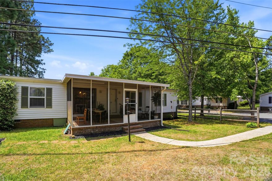 Move-in ready and beautifully updated, this charming mobile home features a desirable split 3-bedroom floor plan with walk-in closets in every bedroom—perfect for maximizing storage—plus an additional 8’ x 12’ storage shed for even more space. Tucked away at the end of a quiet side street, the home offers a peaceful and private setting where you can relax on the porch and enjoy nature. Major renovations completed in 2018 include all new windows, a fully remodeled kitchen with updated cabinets, countertops, sink, stove, refrigerator, and added garbage disposal, new furnace, all new flooring throughout, ceiling fans, fresh interior paint, and remodeled bathrooms, with a new vapor barrier installed in 2022 for added efficiency and protection. Located in a well-maintained and picturesque 55+ community, at least one resident must be 55 or older, with any additional occupant being a spouse or approved caregiver. THIS IS A MOBILE HOME ONLY—land is not included, and there is a monthly LOT RENT of $485 which covers water, sewer, trash, and access to amenities including a clubhouse, game room, swimming pool, shuffleboard, pickleball, and a full calendar of social activities such as dinners, breakfasts, game nights, and more. All buyers must be approved by park management, and all offers are subject to this approval—don’t miss this opportunity to enjoy affordable, low-maintenance living in a welcoming community!