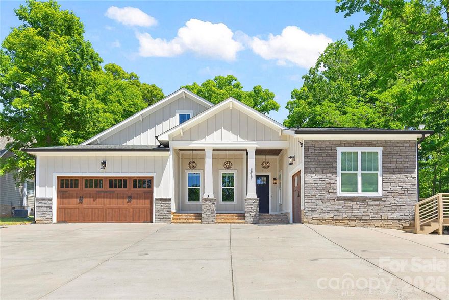 Meticulously crafted with exceptional custom details, this remarkable property offers an unparalleled lifestyle, nestled against a picturesque golf course and overlooking the tranquil beauty of Lake Norman. Located in one of the most established neighborhoods in Westport, this home combines timeless charm with modern amenities, all within the vibrant Lake Norman area. The home’s expansive back-patio doors create a seamless transition between indoor and outdoor living, inviting the serene landscape inside. The patio itself is an entertainer’s dream, featuring a covered area with a gas fireplace for cozy evenings and an open space for basking in the sun. Elevating the outdoor experience is a fully equipped kitchen, installed in the fall of 2021 with premium stainless steel appliances (valued at $20,000), including a custom grill, refrigerator, gas fireplace, and bar, along with a luxurious six-person hot tub, meticulously maintained twice a year. Inside, every detail is designed with comfort and sophistication in mind. Each of the three bedrooms boasts en-suite or adjoining bathrooms, with the first guest bedroom offering outstanding versatility as an in-law suite. Complete with its own private entrance, a secluded patio, a roll-under sink, and a roll-in shower, this space is perfectly tailored for multigenerational living or hosting loved ones with ease and independence. The gourmet kitchen is a chef’s delight, offering double islands, a drink station, and a cutting-edge smart refrigerator (added in February 2025). The heart of the home is anchored by a private courtyard-style patio with gas hookups for grill or firepit. Additional versatile spaces abound, including a flex area perfect as an office or additional bedroom, and a hidden room off the Master Suite, ideal for a craft room or extra storage to complement the spacious double closets. Further enhancing the home’s allure are thoughtful features such as a three-car garage, a generously sized laundry room that doubles as an office, a walk-in pantry, and two additional porches, capturing every moment of the enchanting Westport sunshine. Custom finishes grace every corner of the home, while the fully fenced yard offers privacy and a host of amenities, including an outdoor fireplace with a TV, advanced smart home technology with integrated cameras, speakers, thermostats, and some lighting. Functional upgrades include gutter leaf guards and a comprehensive irrigation system, with sprinklers covering the lush grassy areas in both the front and back yards and drip irrigation maintaining additional landscaped zones. This cutting-edge smart home is designed for modern living, equipped with Nest thermostats, a complete security system, and significant enhancements like the HVAC replacement in June 2023. Environmentally conscious features include Thermoshield insulation and solar panels, which promote energy efficiency and sustainability. For added resilience, the solar panels are paired with a generator, ensuring uninterrupted power in any circumstance. Perfectly situated in the highly sought-after Westport community, this rare and extraordinary property not only embodies luxury and practicality but also benefits from the charm and prestige of one of the most established neighborhoods in the Lake Norman area. With no HOA, this home offers a lifestyle of unparalleled comfort, refinement, and convenience.