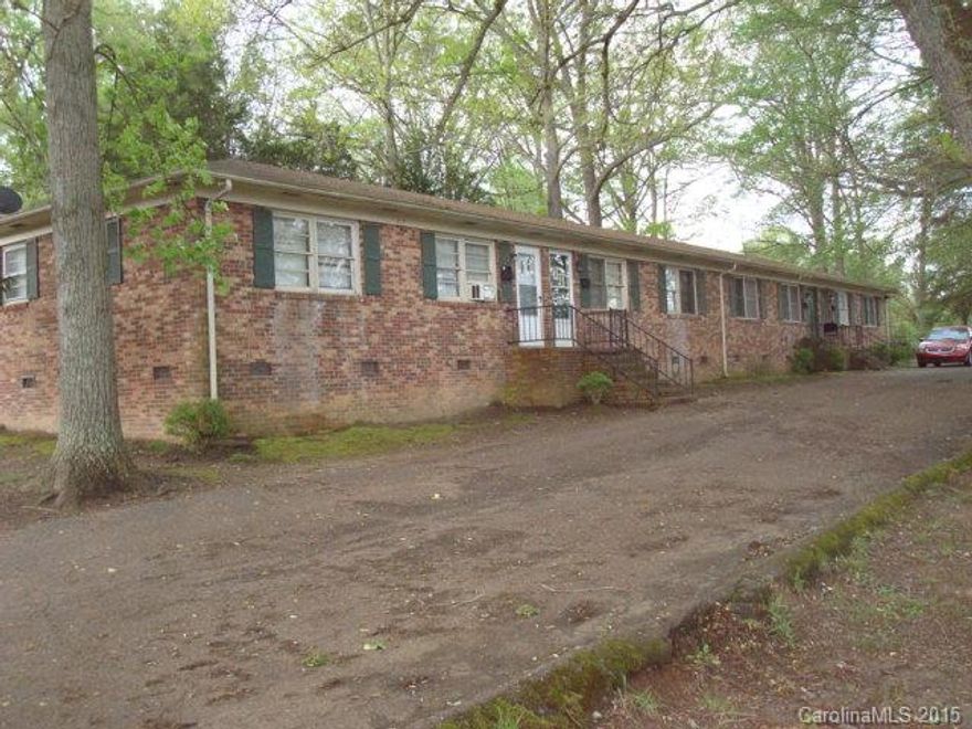 4 unit apartment, brick, each unit has 2 BR's, kitchen, LR, 1 BA. Electric baseboard heat.
