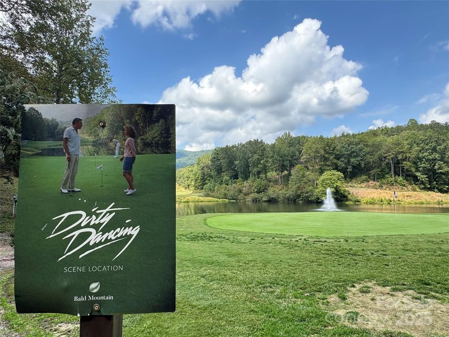 This rare and easily buildable mountain lot sits on the scenic Bald Mountain Golf Course in Rumbling Bald Resort, bordering the very hole featured in the iconic film Dirty Dancing. With gentle terrain and a wonderful golf course view, it’s the perfect canvas for your dream home—whether a cozy cabin or a luxurious retreat. One of the few lots not under the Property Owners Association (POA), offering greater flexibility, fewer restrictions, and lower annual costs. Resort membership is optional, allowing you to enjoy amenities on your terms. Enjoy direct access to two championship golf courses—Apple Valley and Bald Mountain—each offering challenging play and breathtaking mountain scenery. Whether you're a seasoned golfer or just getting started, you'll love living steps from the fairway. Spend your days boating, kayaking, or paddleboarding on the sparkling waters of Lake Lure. The resort’s full-service marina offers boat slips and easy access to the lake. For hiking enthusiasts, Chimney Rock State Park is just minutes away, with dramatic cliffs, waterfalls, and panoramic views. As a Rumbling Bald guest or member, you’ll enjoy access to an impressive array of amenities: lazy river and multiple outdoor pools, private beach on Lake Lure, basketball and pickleball courts, fitness center and spa, boat slips and watercraft rentals at the marina, on-site restaurants offering casual and upscale dining, tennis courts, walking trails, and more! The peaceful mountain setting offers year-round beauty with easy access to Asheville, Hendersonville, and surrounding attractions, making it ideal for full-time living, a vacation home, or an investment property. This lot isn’t just land—it’s a lifestyle. With cinematic charm, resort luxury, and outdoor adventure all in one place, it’s a rare opportunity to own a piece of the Blue Ridge magic!