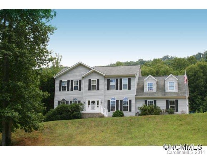 This traditional style home has lots of space for the money.  Situated on a partly level lot with lovely views up Curtis Creek, the home has three bedrooms and a huge bonus room off the master. Flexible use of space to accommodate home office, theater room, play areas - whatever you need! Light and open kitchen, great yard for play, pets or garden in gorgeous setting!