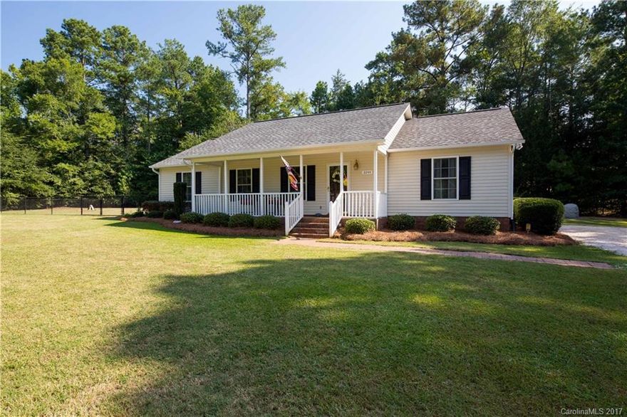 One of a kind!!! Ranch home resting on a corner lot with a flat acre of land!! Tired of city living, look no further - large laundry room, open floor plan, split bedroom plan, and more! Relax with the spacious yard and take in the views of the professional landscaping! On cool nights you can even take a dip in the 5 person hot tub or listen to the birds on the rocking chair front porch! There is a large storage building and another utility building that convey as well!