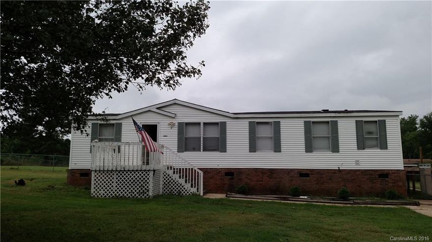 Property has 24 x 26 Wired shop, with 2 bay doors and wood burning stove, fenced back yard with 75 Cypress trees planted around property for privacy. Needs some TLC but lots of potential, sold as is.