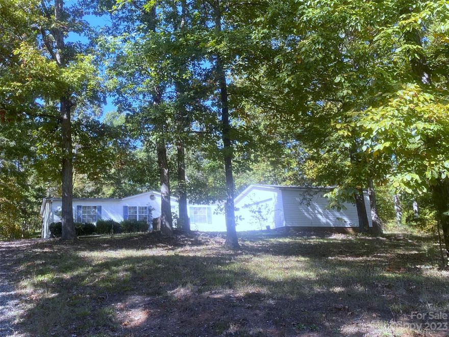 3BR/2BA home priced to sell quick, No city taxes, spacious floorplan, Lg. Great Rm with lovely ceiling fan, this home sits on 4.83 acres. front and rear decks to be repaired or replaced. Home being sold AS IS. At this price  It will not last long! Seller is a N.C. licensed Broker.