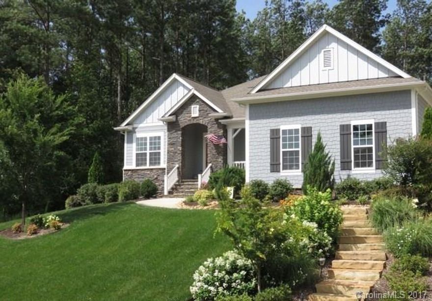 Stunning craftsman home in popular lake community! Impeccably maintained home offers open floor plan w/ tons of upgrades. Impressive kitchen w/ exotic granite countertops.Ex large island-seats 6. Double ovens. Induction cooktop.Gorgeous hardwoods in all main living areas. Large master ensuite. Wooded, fenced backyard.Stone patio for outdr living. 10½’x30’ covered back porch. 15-20 minutes to: Uptown Charlotte/CLT/National Whitewater Center/Northlake Mall. See attachments for many upgrades.