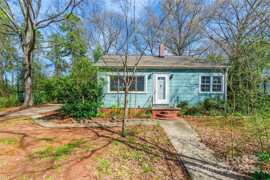 Discover the charm of this 3 bedroom, 1 bathroom home nestled on a spacious half-acre. Positioned back from the road on a flat lot, this home offers a bright & airy atmosphere. Gather in the dining room adorned with chair railing, while an extra room off the kitchen provides flexibility as a den or office. The bathroom features a convenient bathtub-shower combo & dual sinks for added comfort. Additionally, a finished attic w/ pull-down stairs offers bonus space, including a den & another bedroom, this space is not HLA. A 2-car carport & shed are also included. Newer windows and a roof, replaced in approx. 2022 with architectural shingles, adds to the home's appeal. Enjoy the shade of mature hardwood trees in the yard. While lovingly maintained over the years, some TLC is needed—carpets require replacement, and the kitchen sink needs upgrading. Conveniently located near the interstate, shopping, and dining options, this home offers both comfort and potential for the discerning buyer.