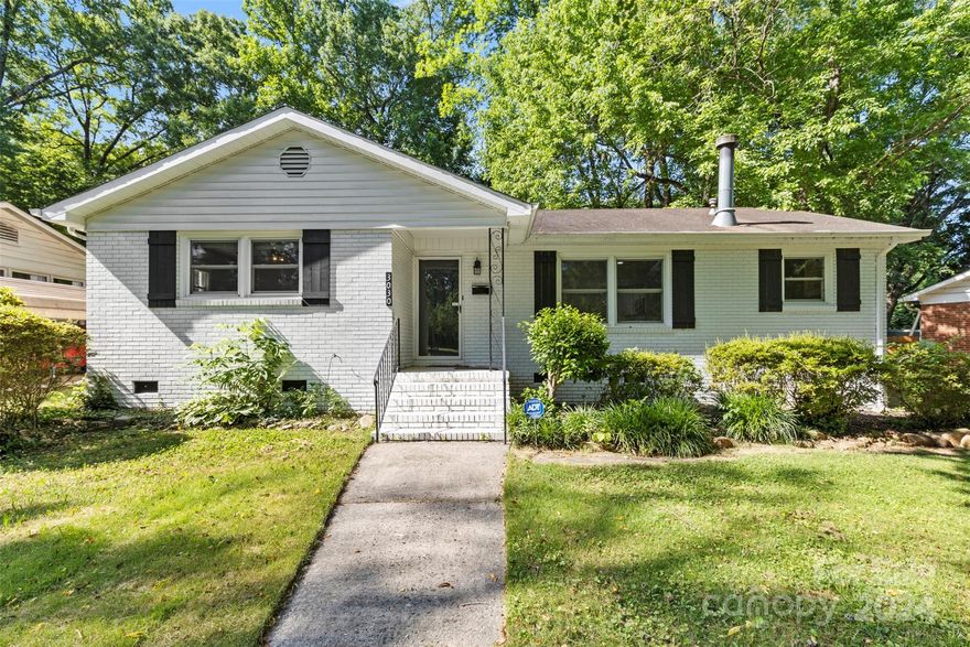 Welcome to this charming ranch home nestled in the desirable Country Club Heights neighborhood in Charlotte. Upon entering the home, you'll be greeted with an open floorplan featuring a cozy wood-burning fireplace in the living room. This delightful residence boasts modern LVP flooring throughout. The kitchen is complemented by sleek quartz countertops with white cabinetry, kitchen island, and SS appliances. The home features a separate laundry room and an additional mudroom. The bathroom has newer tile, toilet, and tub fixtures ensure a fresh, contemporary feel in the bathroom. Outside, you'll find expansive front and back yards, providing ample space for outdoor activities and relaxation. Located in a prime central spot, this property is just moments away from the prestigious Charlotte Country Club, scenic parks, and an array of dining and shopping options.