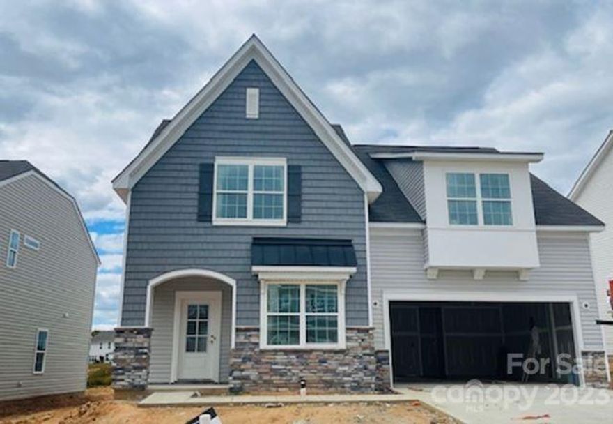 Last Inlet model - featuring a primary bedroom on main level. Plus this homesite is one of our largest at 1/4 acre! You'll also appreciate the fabulous gourmet kitchen with DOUBLE ovens, 36-in. gas cooktop (vented to outside) and microwave/air fryer. The oversized island also has extra seating and the walk in pantry has more places for kitchen storage. There is also a flex room or office space on the main level. Upstairs you find a giant loft area that is perfect for a main entertaining space or bonus room. All three additional bedrooms upstairs are oversized with walk in closets and one having a private bath.

The neighborhood offers a new outdoor pool, splash area, fitness center and clubhouse. Sidewalks, street lights and walking trails add to the charm of Gambill Forest. Downtown Mooresville is located just a mile down the road with shops, restaurants and everyday conveniences.