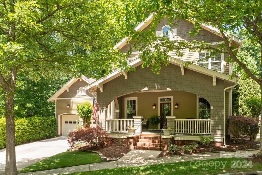 Walk/bike to town and the college from this Davidson craftsman home.  The rocking chair front porch leads you into the sophisticated, elegant interior.  Walk past the tasteful dining room and living room into the great room which opens into the newly updated gourmet kitchen.   The primary suite is on the main level and features a luxurious bathroom and sitting area. The primary opens to the covered sunroom which provides access to the calming, fenced back yard with multiple decks and water features.   Upstairs provides 4+ bedrooms and a central recreation area with a giant office/library in the rear.   Newly epoxied floors in the oversized garage provide ample space for your toys.  Abutted in the rear by wooded Davidson College property and a wooded common area to the left, this lot provides unmatched privacy.  Close to Historic Main Street Davidson with its boutiques, restaurants and Farmers Market.  Convenient to Lake Norman, Uptown Charlotte and Charlotte-Douglas Intl Airport.