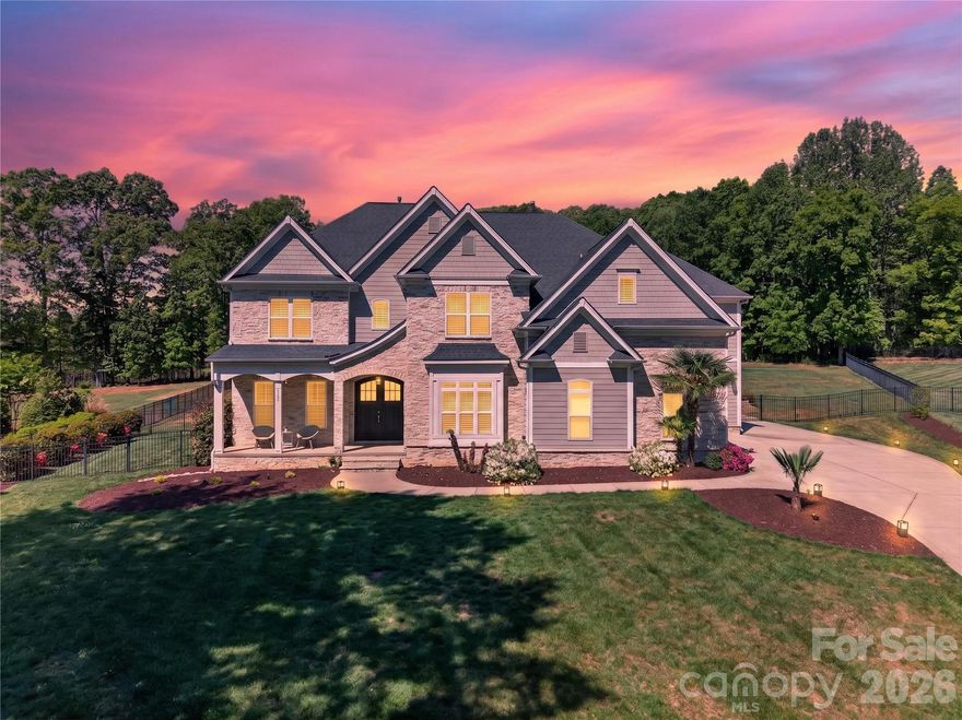 Behind the private gates of The Enclaves at Chesapeake Pointe, this exceptional estate redefines refined living with a seamless blend of sophistication, comfort, and resort-inspired design. Nestled on an expansive 1.80-acre homesite, the property offers a rare sense of privacy, enhanced by a fully fenced backyard sanctuary. Step outside to your own curated oasis—an extraordinary outdoor retreat designed for both relaxation and entertaining. The heated, resort-style pool features an elegant tanning ledge with bubblers, complemented by a separate in-ground spa, creating an ambiance reminiscent of a five-star getaway. Inside, every detail has been thoughtfully considered to elevate the living experience. The main level showcases a private executive office, ideal for working in style, along with a versatile fitness studio that can easily adapt to your lifestyle needs. The heart of the home is a luminous, chef-inspired kitchen adorned with pristine white cabinetry, designer countertops, and an expansive island with bar seating, in addition to a charming built-in dining nook, perfect for casual gatherings or morning coffee. Flowing effortlessly from the kitchen, the inviting keeping room features a striking stone fireplace flanked by custom built-ins, offering warmth and architectural elegance. The grand great room impresses with its scale and sweeping views of the outdoor retreat, creating an ideal setting for hosting guests in style. An expansive formal dining room that is currently reimagined as a sophisticated recreation lounge, offers endless possibilities, from an upscale entertaining space to a private retreat tailored to your passions. This remarkable residence is a masterclass in luxury living, where every space has been designed to inspire comfort, connection, and effortless elegance. Ascend to the upper level, where the private quarters continue the home’s theme of elevated luxury and thoughtful design. The primary suite is a true retreat, an expansive sanctuary designed for rest and indulgence: featuring dual walk-in closets, including an extraordinary, boutique-style dressing room the size of a bedroom, curated to showcase even the most discerning wardrobe. The secondary bedrooms are generously proportioned, offering both comfort and privacy. One suite enjoys its own private bath, while two additional bedrooms are connected by a beautifully appointed Jack-and-Jill bath, blending convenience with refined style. The third level unveils a versatile bonus suite complete with its own bathroom, an ideal space for a private guest retreat, media lounge, or elevated entertainment space. Even the everyday essentials are elevated here with the well-appointed laundry room that impresses with abundant cabinetry and expansive counter space, designed to make daily living as seamless as it is stylish. Completing the home is a spacious three-car garage, offering ample room for vehicles, storage, and recreational pursuits. And when it’s time to unwind, the covered rear porch provides a shaded escape that is perfect for enjoying tranquil evenings overlooking your private outdoor haven. This extraordinary residence offers a lifestyle of comfort, elegance, and distinction at every turn.