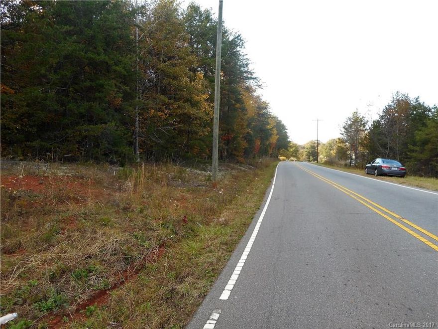 4 unrestricted level and wooded acres with frontage on 2 roads! Approximately 245' of frontage on Hudlow Road and approximately 75' on Rob Long Road. Mountain view off Hudlow Road. This parcel can be subdivided and has unlimited potential, both residential and/or commercial. Checking on availability of public water & sewer and survey. County incorrectly has listed as 2 acres. Call for more information.