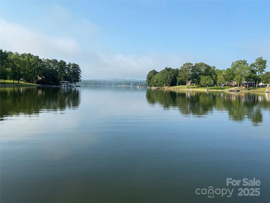 Embrace your lake dreams with this fantastic cabin! This perfect weekender has great water and huge views out to the main channel. A perfect screened porch waits for your mornings with coffee while the convenient patio sets the stage for grilling dinner. You'll love the brand new modern kitchen with tall lighted cabinets, sleek new stainless appliances and finished concrete counters. Congregate around the island or enjoy the updated great room with open spaces and new LVP flooring. The huge screened porch is sure to be a hit! The home has also been updated with new electric throughout. An almost one acre lot has plenty of space for additions or a new build behind the cabin. Selling turn key and priced to move! Don't sleep on this one!