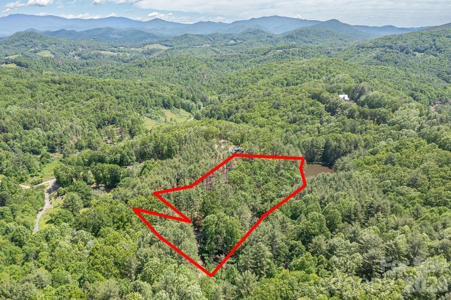 Huge Value! Discover this pristine mountain retreat in the sought-after Rivers Edge Subdivision, the perfect canvas for your future dream home. This exceptional property offers multiple flat, easily accessible building sites, giving you the freedom to design with flexibility and maximize mountain-living potential.

Surrounded by towering mature trees and natural privacy, the land feels peaceful and secluded while remaining part of a well-planned community. A special highlight is the private pond that borders the property—ideal for quiet mornings, wildlife watching, and enjoying your own slice of nature’s serenity.

Whether you're envisioning a cozy cabin, a modern mountain getaway, or a long-term investment, this lot delivers an unmatched blend of tranquility, beauty, and recreational enjoyment. Opportunities like this—featuring usable terrain, water features, and mountain character—are rare. Don’t miss your chance to build something extraordinary at Rivers Edge.