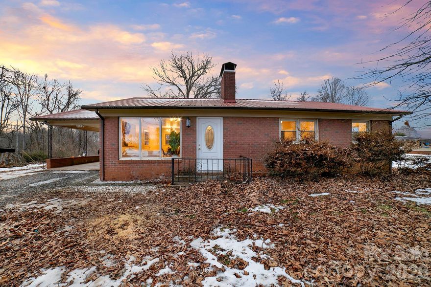 Updated 3-bedroom, 1-bath brick ranch home with metal roof!! This move-in-ready home blends classic charm with modern finishes throughout. Step inside to find all new vinyl plank flooring, fresh paint, and stylish updated lighting creating a bright and welcoming interior. The kitchen features stunning Carrara Prima quartz countertops and brand-new stainless appliances including a ceramic 5-burner cooktop, built-in wall oven, front-control smart dishwasher, and touch-control under-cabinet range hood — perfect for both everyday living and entertaining. The beautifully updated bathroom offers a spa-like retreat with a deep soaking alcove tub surrounded by elegant marble-inspired ceramic tile. Updates include: new HVAC system with new air-handler and heat pump, new air-conditioner and Honeywell thermostat. The full unfinished basement provides a blank canvas of opportunity. Brick construction, modern upgrades, and turnkey condition make this an ideal home for homeowners or investors alike. Property is outside of Granite Falls town limits and has no city taxes payable. Seller is an entity in which the listing agent’s spouse has an ownership interest.