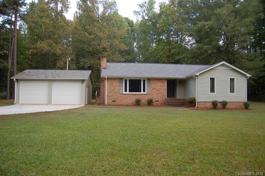 Adorable ranch style 3 bedroom/2bath home in Wintercrest subdivision.  New carpet, new hardwood, new vinyl, new HVAC, new roof!  Large family room with wood burning fireplace, nice kitchen with eat in dining.  Two car wired detached garage, additional storage building, new decking.  Wooded and private backyard on nearly an acre lot.  No city taxes!  Great neighborhood and convenient location.  Must see this one today!