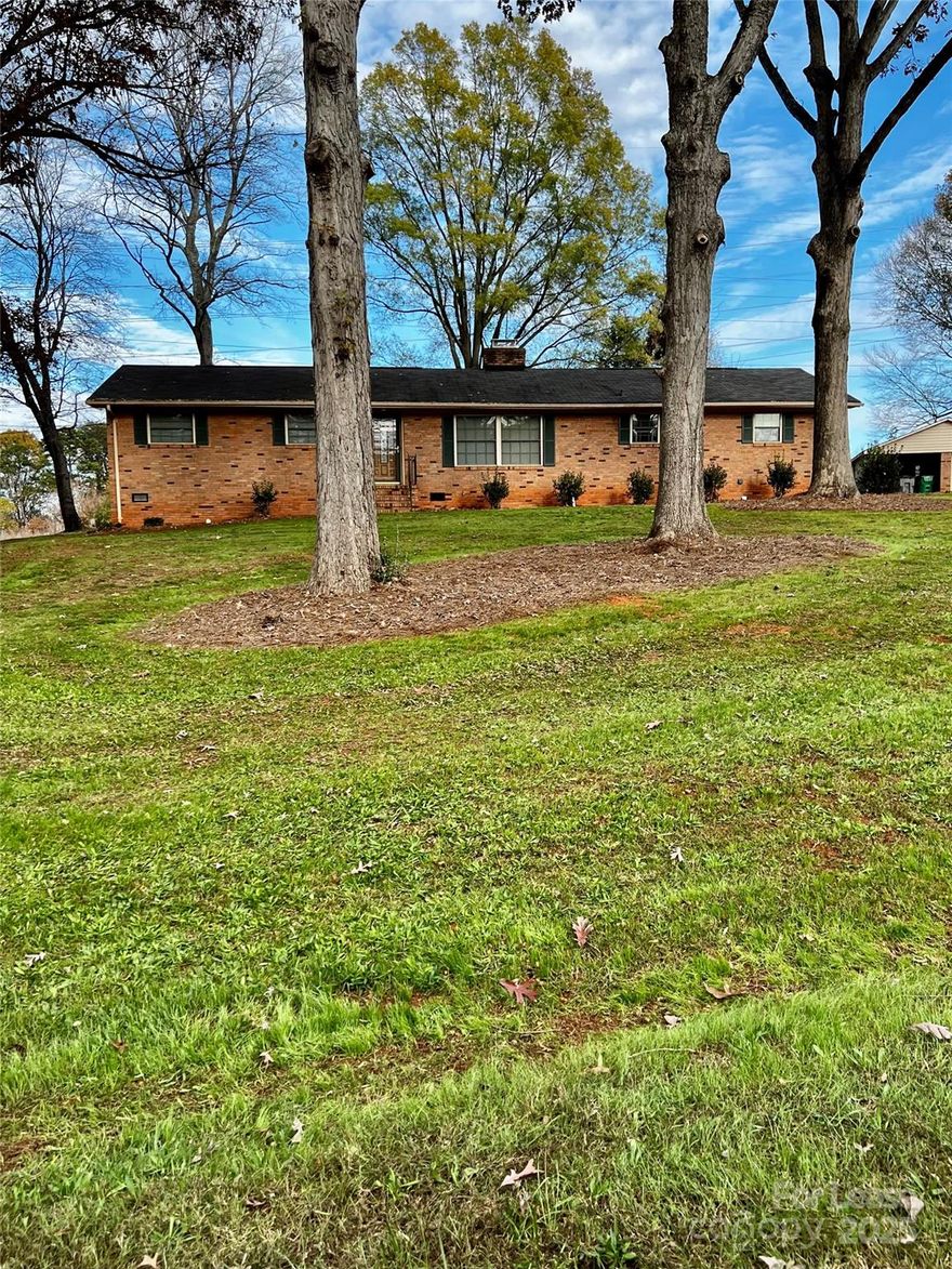 Beautiful all brink ranch home in quiet established neighborhood close to uptown Charlotte, CLT airport, shopping, restaurants and the White Water Center. This home has 4 large bedrooms and 2 full baths, family room with fireplace.  Enclosed sunroom for relaxing and outdoor patio area. Home also a 2 car garage/shop for additional storage.  ***  Available 8/1/2025  ***