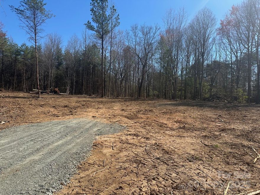 This private lot is partially cleared and ready to pull permit to construct dwelling. Convenient location with easy access to Hwy 150 and Hwy 16 along with shopping and boat access at nearby boat landing. Lot includes a gravel drive with direct access to paved state road, survey with all property corners marked along with an approved septic permit for a 3 Br home. Come build your dream home or consider a barndominium from our select builder.