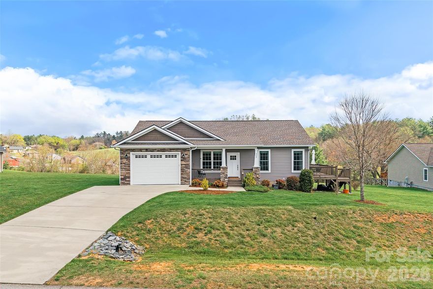 Main level living with mountain views from your living room! Arts & Crafts style home ideally located in the walkable and desirable Waters Edge Subdivision. This open floor plan living home offers natural light pouring in from every window. Covered front porch and spacious side deck with long range mountain views. Beautiful pre-finished wood floors throughout kitchen and main living area. Stainless steel appliances, large kitchen island and granite counter tops in the kitchen. Minutes to the Ecusta trail, downtown Hendersonville, Etowah Golf Course, Asheville Airport, restaurants, shops and more! Book your showing today!