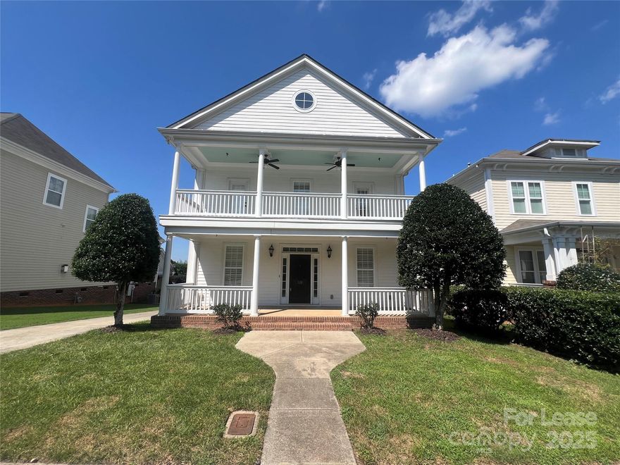 Welcome to this stunning 4-bedroom, 3.5-bath home located in the heart of McAdenville Village—just minutes from downtown charm, boutique shops, restaurants, and all the magic of Christmastown USA!
This spacious two-story home features inviting double covered porches with charming ceilings & ceiling fans, perfect for relaxing in style. Inside, you'll find hardwood flooring throughout main level, formal dining room, and flexible front room that’s ideal as a home office or sitting area with built-in shelving. Large kitchen & breakfast nook, featuring granite countertops, cabinet space, stainless steel appliances, and a pantry.  Primary suite offers a luxurious soaking tub, granite double vanity, and a spacious walk-in closet. Two bedrooms share a Jack-and-Jill bathroom, while the third has access to its own full bath. Enjoy private access to the upper balcony from bedrooms.  House has plantation shutters, detailed crown & window moldings, a large back deck, and a detached 2-car garage.