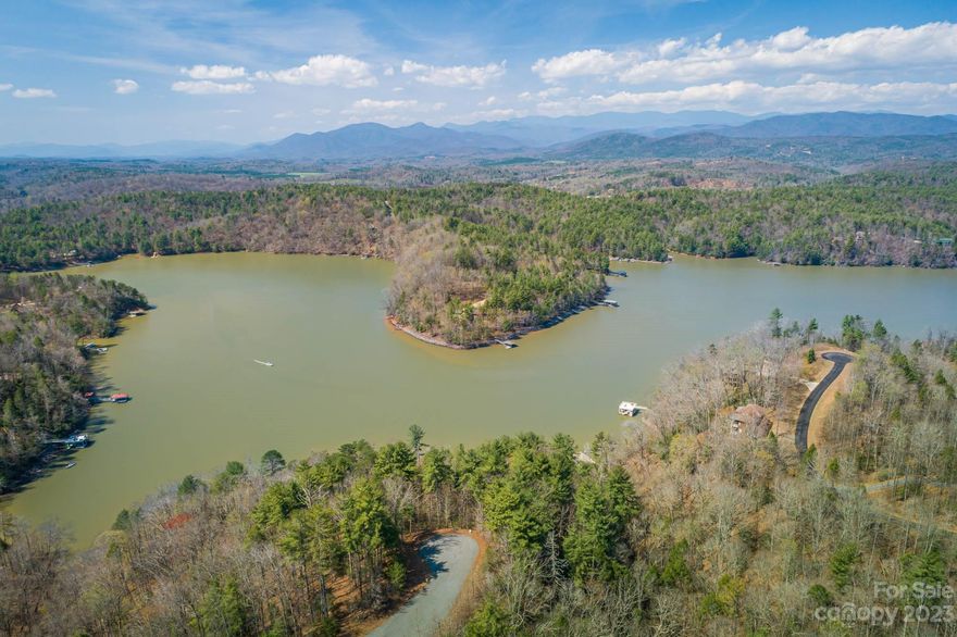 Beautiful lake and mountain views from this waterfront homesite Sloping lot with views toward the Blue Ridge. Rock shoreline for natural stabilization. Perfect spot for your full time residence or vacation home with walkout basement. Lot located on quiet culdesac in gated community of The Arbor on the southwestern end of Lake James. Well and septic needed. *200 feet water frontage with 78 feet allowable dock frontage. Original Duke pier permit for 770sq ft,double deck dock can be renewed,  Septic lot 127A conveys with this property. PIN # 1723-00-135358 db 1362 pg 768. Lot recently surveyed. Just 10 minutes to downtown Marion shops, restaurants and breweries.