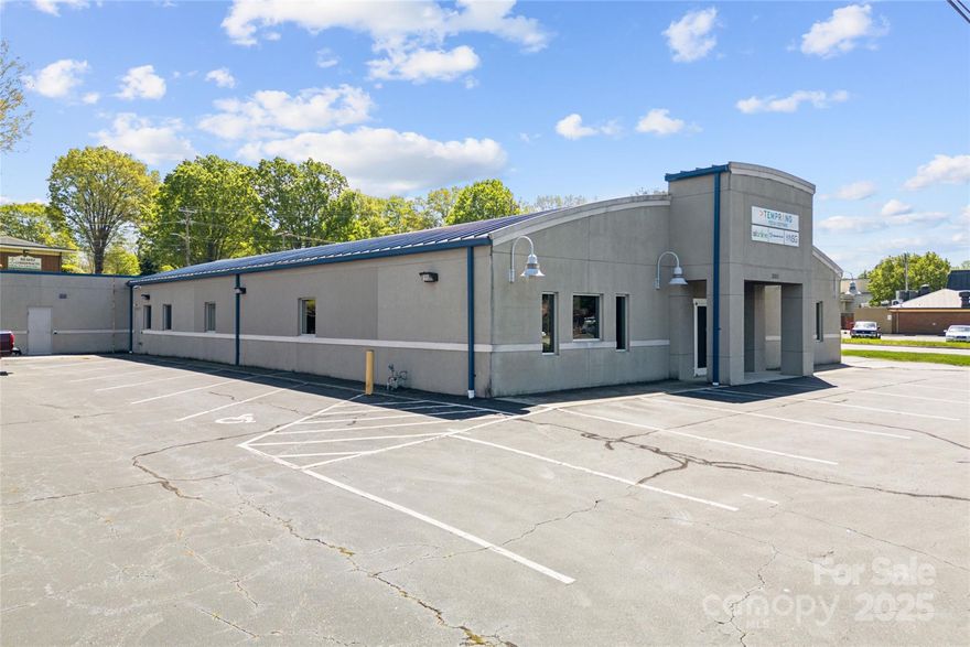 Welcome to your new headquarters in Newton, NC! This prime commercial real estate gem offers unparalleled convenience, strategically located with easy access to Hickory, Statesville, Lincolnton, Charlotte, and neighboring counties. Versatile and spacious, this building is tailor-made for your organization’s needs, whether it's a call center, general office space, or an office with customer-facing facilities. Boasting a welcoming front reception, two expansive showrooms, four large flexible rooms for cubicles or conference rooms, six private offices, kitchen and dining room, and separate public/private bathroom facilities, this space ensures both comfort and functionality. With dedicated areas for storage, electrical, and server rooms, plus a janitorial closet, every aspect of your operation is accounted for. Don't miss this opportunity to elevate your business presence in an ideal location! The owner will consider owner financing with 60% down.
