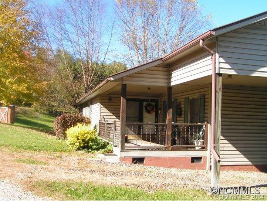 Excellent location on west side of Burnsville off new 4 lane, so great for commuting.  Nice 2 bed/2 bath home on level lot with pretty mountain views.  House is mobile with addition, carport, furnishings can go with house, so ready to move in...just bring your toothbrush!  Great price, motivated sellers and will not last!