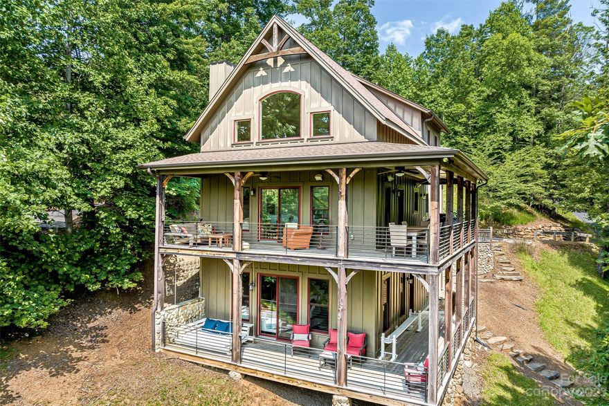 A west-facing lakefront gem nestled in a beautiful cove on Lake James. This stunning property offers an exceptional blend of luxurious living and short-term rental potential, making it an opportunity for homeowners and investors alike. Featuring a prime location in a low boat traffic cove out of the main channel, providing a serene setting for relaxing and recreation. The furnished home's layout allows for guests to spread out in their own space with 2 bedrooms and a full bathroom upstairs, the primary on the main, and a bonus room with closet, bathroom, 2 sleeping nooks and family room in the high ceiling, daylight basement. Wrap around decks on the main and basement level bring the indoors and outdoors together while adding additional living space. The property extends to a large aluminum, floating dock with a boat lift, storage box, and views of Dobson Knob.