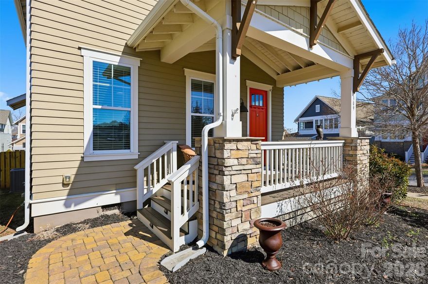 Located in the desirable Riverwalk community, this well-maintained home offers added privacy on a corner lot with only one adjacent neighbor, plus additional backyard space and parking.

Exterior features include covered front and rear porches, a fully fenced backyard, and a detached two-car garage with two additional private parking spaces. Storage area available beneath the rear deck.

Built by Evans Coghill Homes, the interior features an open-concept layout with abundant natural light, site-finished hardwood floors, detailed moldings, and dovetailed cabinetry. Kitchen includes stainless steel appliances, beveled subway tile backsplash, and an oversized island with seating for six. Fresh interior paint recently completed.

Community amenities include pool, pocket park, walking trails, and river access. Conveniently located near Rock Hill BMX Supercross Track, Giordana Velodrome, dining, shopping, and major highways.