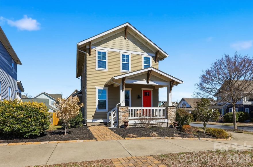 Nestled in the vibrant, amenity-rich community of Riverwalk, this well-maintained home offers a wonderful combination of comfort, privacy, and convenience.

Positioned on a desirable corner lot, the property benefits from having only one adjacent neighboring home instead of two, providing extra privacy along with a larger backyard area and additional parking. Enjoy relaxing on the inviting covered front and rear porches, or take advantage of the fully fenced backyard—perfect for outdoor gatherings, pets, and everyday enjoyment. A detached two-car garage offers ample storage as well as two additional private parking spaces.

Built by Evans Coghill Homes, the home is filled with natural light thanks to numerous main-level windows and showcases quality craftsmanship throughout. Interior highlights include detailed moldings, site-finished hardwood floors, dovetailed cabinet drawers, stainless steel appliances, and a beveled subway tile backsplash. The oversized kitchen island, with seating for six, anchors the open-concept layout, creating an ideal space for entertaining and daily living. Fresh interior paint has recently been completed.

Additional storage is available beneath the back deck, offering a spacious area perfect for lawn equipment, outdoor gear, and or kayaks.

Residents enjoy easy access to a variety of nearby recreational amenities, including a community pool, pocket park, scenic walking trails, and river access for tubing. The neighborhood is also home to the acclaimed Rock Hill BMX Supercross Track and the Giordana Velodrome, along with nearby dining, shopping, and convenient highway access.