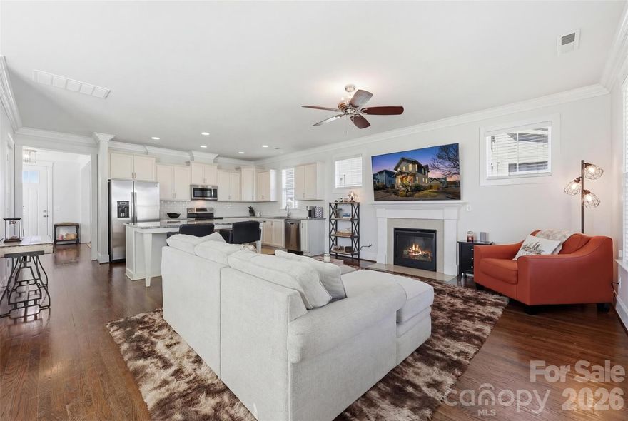 Located in the desirable Riverwalk community, this well-maintained home offers added privacy on a corner lot with only one adjacent neighbor, plus additional backyard space and parking.

Exterior features include covered front and rear porches, a fully fenced backyard, and a detached two-car garage with two additional private parking spaces. Storage area available beneath the rear deck.

Built by Evans Coghill Homes, the interior features an open-concept layout with abundant natural light, site-finished hardwood floors, detailed moldings, and dovetailed cabinetry. Kitchen includes stainless steel appliances, beveled subway tile backsplash, and an oversized island with seating for six. Fresh interior paint recently completed.

Community amenities include pool, pocket park, walking trails, and river access. Conveniently located near Rock Hill BMX Supercross Track, Giordana Velodrome, dining, shopping, and major highways.