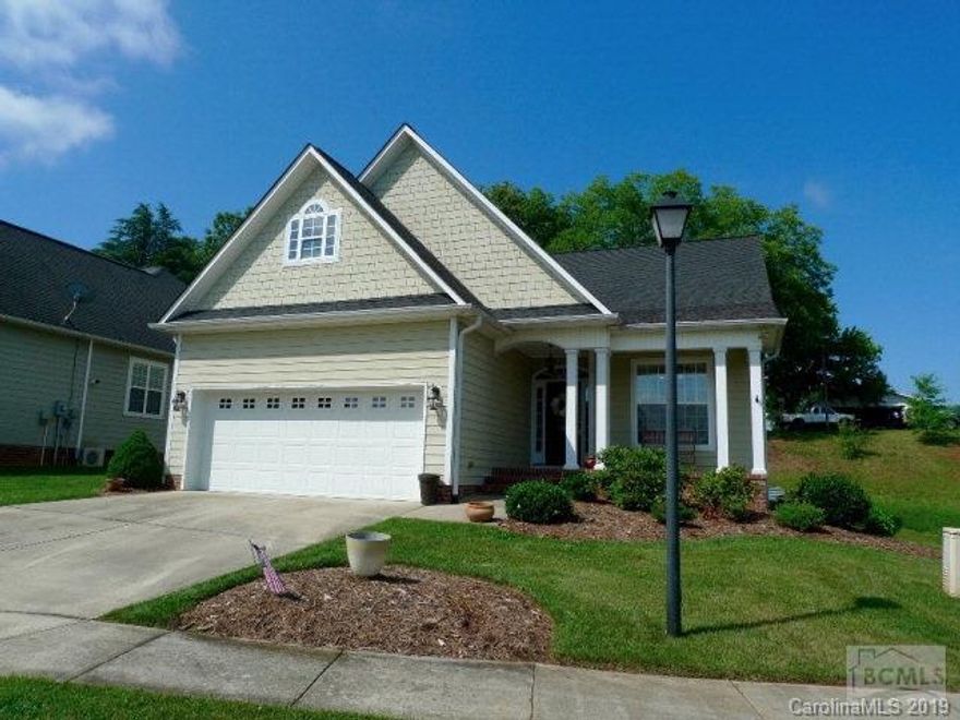 Charming three bedroom two bath cottage style home in Henry's Glen. Open living plan with over 1800 square feet. Formal dining area and the vaulted living room with fireplace. Open kitchen with breakfast area.   Screened porch and covered porch area off breakfast room.  The master suite has a large bedroom, bath with whirlpool tub, shower and walk-in closet. Two large bedrooms, hall bath and laundry room are separated from master. The unfinished bonus space over the garage would make an ideal media room, game room, exercise room, or additional living space. Home has hardwood floors, ceramic tile baths and 9 foot ceilings. Two car garage with storage area. Spacious, open and bright.  Convenient to downtown Morganton.