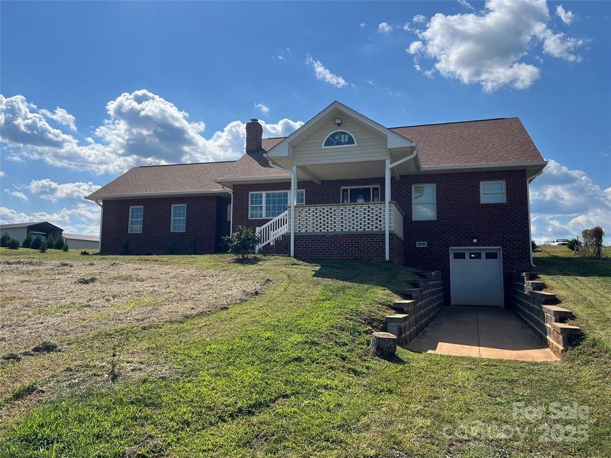 Major Price Improvement! Perched on a hillside for added elevation and sweeping views, this 28.72-acre deeded farm offers both comfort and opportunity.  The brick home, built in 2020, features granite countertops, basement, and a wood furnace to keep you warm through the winter on a budget.  With three bathrooms and spacious bedrooms - each with large walk-in closets and custom-built cabinetry - this home is designed for both style and function.  Additional highlights include a double attached garage, barns, sheds, and fenced pastures with convenient access from goth the road and residence driveway. This is a true working farm, equipped with livestock and equipment at no added value to keep operations running from day one.  Included are two tractors one being a 2021 Mahindra Retriever 1000, a hay baler, rack, spreader, 2022 Axis side by side, plus livestock including approximately 50 goats, 5 head of cattle, and approximately 23 chickens. Shelby Livestock Auction is just 9.2 miles away, making marketing your animals convenient.  Whether you're looking to expand your agricultural business or start fresh in a turnkey operation, this property is ready to welcome you.