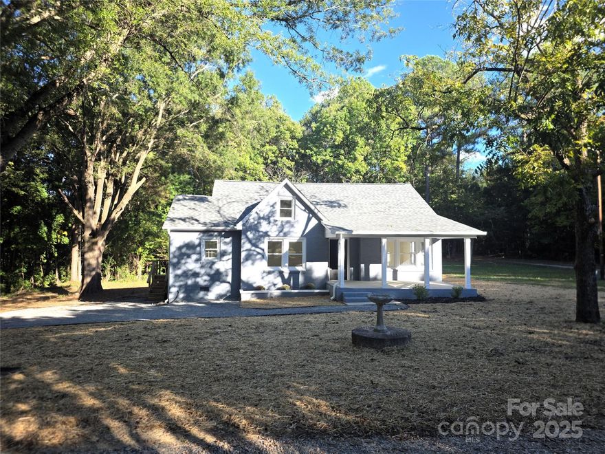 Nestled on a peaceful half-acre lot located between minutes from downtown Kannapolis and I-85, this beautifully reimagined 3-bedroom, 2-bath home blends warmth, style, and convenience. From the classic exterior and porch s to the open, sun-filled interior, every inch of this home has been thoughtfully renewed.

Step inside to a bright, vaulted living space with luxury vinyl plank flooring and an effortless open layout—perfect for entertaining or relaxing in style. The kitchen is a showpiece, featuring soft sage shaker cabinetry, custom granite countertops, stainless-steel appliances, and matte-black fixtures. Natural light pours through the windows, highlighting the seamless connection between the kitchen, dining, and living areas.

The primary suite is a private retreat with plush new carpet, a walk-in closet, and a spa-inspired ensuite bath with striking tilework and a walk-in shower. Two additional bedrooms and a second full bath offer flexibility for family, guests, or a home office.

Outdoors, enjoy your own half-acre of peaceful privacy surrounded by mature trees—perfect for morning coffee, evening gatherings, or just soaking in the serenity. With new electrical, plumbing, roof, and gutters, this home offers beauty, comfort, and confidence all in one.

Located just minutes from I-85, shopping, restaurants, and the growing downtown Kannapolis entertainment district, this home pairs modern living with small-town charm   Listing Agent is the owner.