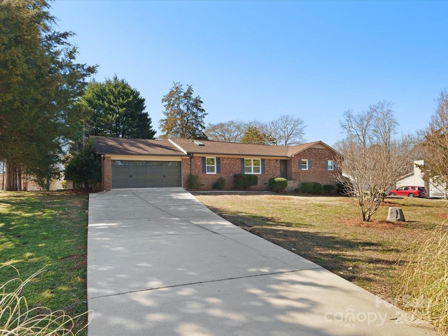 Rare find, minutes from Downtown Rock Hill, this updated, all brick ranch on over .5 acres for under $400K! Beautifully renovated, this classic split living area floor plan mixes the traditional ranch footprint with modern natural light and ample square footage.  All new LVP floors throughout, all new windows to exterior, reinforced concrete in the sunroom floor, brand new Kitchen cabinets, granite countertops, and matching stainless steel appliances, topped off with brand new light fixtures, fresh paint and bathroom vanities.  With over 2,000 sq. ft of heated space, the attached 2-car garage and the shed add to the appeal.  Minutes from schools, shopping and restaurants, don't wait to set up your appointment to see this home. Fireplace wood burning stove sold as is