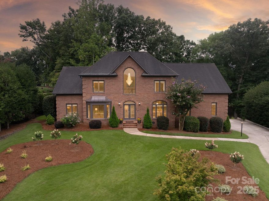 Welcome to a stunning fusion of luxury and function in this impeccably renovated estate. A grand two-story foyer with a dramatic curved staircase sets the tone, flanked by an elegant dining room and a sophisticated home office. Refinished hardwoods lead you into the heart of the home—an awe-inspiring great room with soaring ceilings, a custom library bookcase, and a wall of glass opening to a stone patio overlooking the 13th green. Bathed in natural light, the home flows seamlessly into a chef’s kitchen designed to impress: timeless quartz countertops, custom cabinetry, Hallman double oven with rotisserie, pot filler, dual dishwashers, and both prep and kitchen sinks. Thoughtful details abound—main-level guest suite, two powder rooms, mudroom with drop zone, and a pet washing station. Upstairs, unwind in a luxurious owner’s retreat with spa-like bath, plus two junior suites, media room, and laundry. With room for a pool, this showpiece is tailored for exceptional living & entertaining.