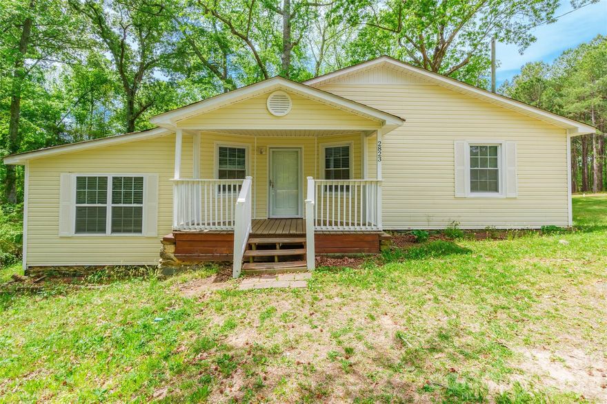 Tucked away on over 3/4 acres, this 2-bedroom home features an open kitchen layout and a comfortable, functional living space. Enjoy peaceful outdoor living on the back deck overlooking the private setting, offering room to relax and unwind. The property borders a creek in the back and offers an outbuilding for additional storage.