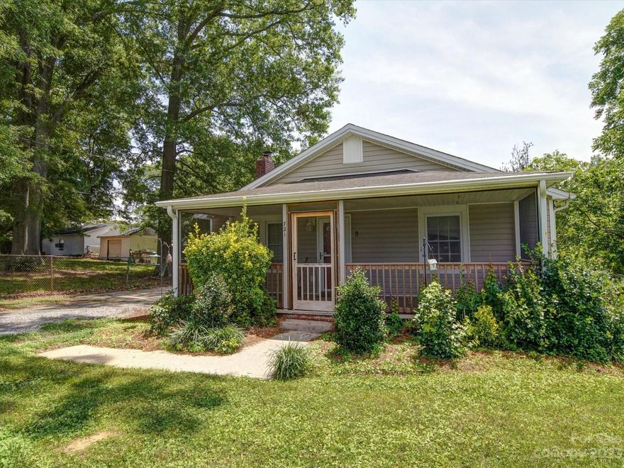 Cute and convenient, just a hop, skip, and jump to Gastonia and Lowell shopping, dining, and interstate access.  Charming bungalow with screened front entry porch.  Spacious interior with large eat-in kitchen.  Nicely updated with vinyl plank flooring, modern kitchen with smart looking black appliances.  Refrigerator, washer, and dryer to remain.  Laundry is located in enclosed back porch. Fireplace is sealed over and seller makes no representations about its condition but the mantel is a handsome focal point in the living room. Gaston County Environmental Health has provided septic record, however, they can not assure it is for this property.  Seller discloses that toilet is served by septic tank. Other waster line is connected to Town of Lowell.   Wide driveway with wired 12 x 12 out building.  Basement/crawlspace has recent vapor barrier. Side porch could use some repairs caused by carpenter bees.  Selling home "as-is", making no repairs.