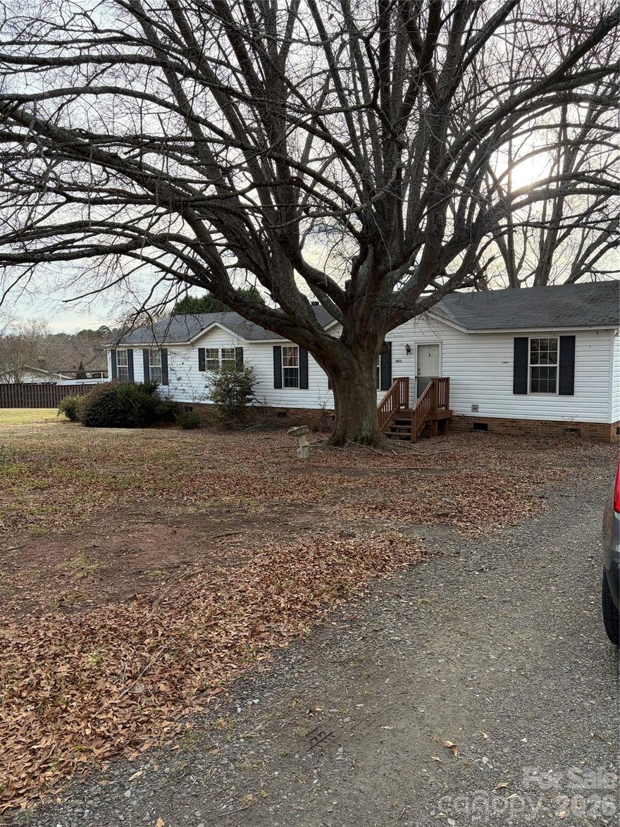 Beautiful Doublewide on .94 acre.  Detached carport and fenced backyard.   4 bedrooms and office space off primary bedroom.  Family room with fireplace.   Formal living room.