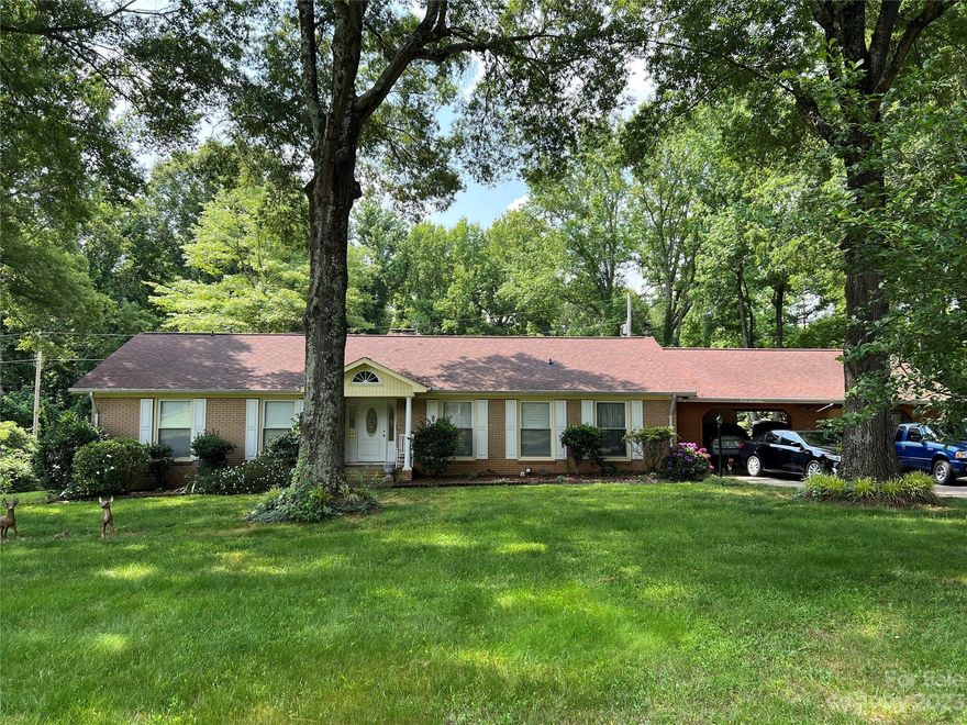 Car or shop enthusiasts dream...w/ detached garage workshop. Home also offers a screened porch & deck, oversized attached carport that could easily convert to a garage. Owner removed a wall and increased the size of the Primary BR. Closet for one secondary BR is in the hallway. 3rd BR with closet is off the kitchen w/ access to carport & access to rear deck. Home is being sold in as-is condition but has been maintained well. You will love the potential this home offers as well as the very large property (1.69 acres)! Home is very unique & was custom built by the original owner per the current owner. HVAC is brand new (less than 1 yr installed), refrigerator, washer & dryer remain...Will not last long!