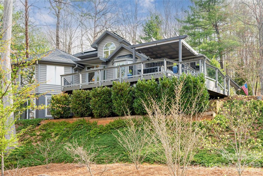 Elevated on a hill in highly desirable Hills of Beaverdam community in North Asheville, this thoughtfully updated home captures sweeping, year-round long-range views of the western mountains and pairs them with a flexible floor plan designed for modern living.
A welcoming wraparound deck invites you to take in layered sunsets and cool mountain breezes, while the rear of the home offers a beautifully landscaped garden with a private patio—perfect for outdoor dining, quiet mornings, or entertaining.
Inside, the main level features an open, light-filled floor plan anchored by the primary suite for easy one-level living. The upper level offers a spacious two-bedroom guest suite, creating comfortable separation and privacy for family or visitors. The lower level expands the home’s versatility with a private-entry guest apartment or office complete with a small kitchen—ideal for extended stays, multigenerational living, remote work, or income potential.
Sustainability meets convenience with solar electric and electric vehicle charging capability, delivering energy efficiency without compromise.
With panoramic views, multiple outdoor living spaces, and adaptable interior options, this North Asheville property offers a rare combination of scenery, flexibility, and forward-thinking design.