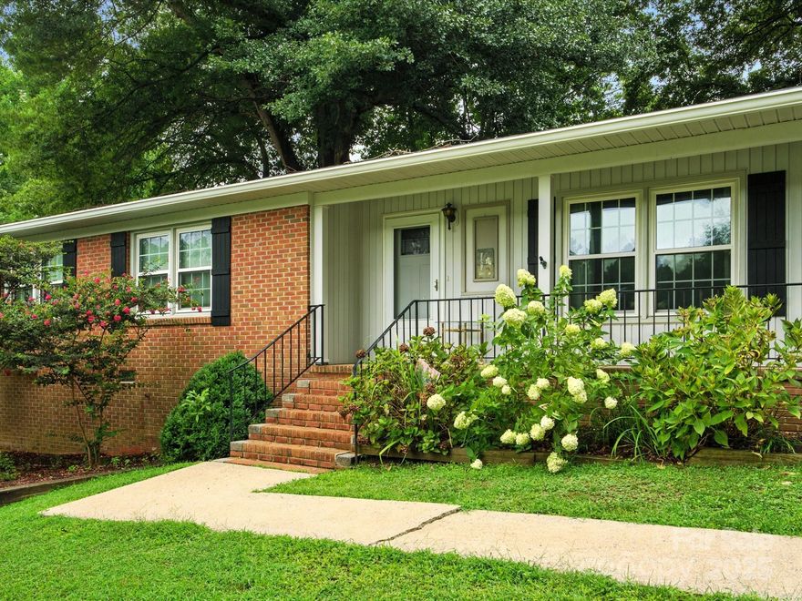Charming Brick Ranch in Rock Hill - Nearly ½ Acre Lot!  Welcome to this beautifully maintained one-story brick home nestled on a spacious nearly half-acre lot in an established neighborhood just minutes from Downtown Rock Hill and Winthrop University. This 3-bedroom, 1-bath home features wood floors throughout most of the home, an updated kitchen with granite countertops, gas range, pull-out shelves, and elegant cabinetry-perfect for home chefs who love function and style. Enjoy your morning coffee or evening relaxation on the front porch or the screened-in porch which overlooks the fenced backyard with mature landscaping, a stamped-concrete patio, gas line for grilling, and a large storage shed with electricity for all your outdoor tools, toys, and workspace.  2023 - Roof and dishwasher replaced.  Oversized 1-car garage!  Property is being sold AS-IS.